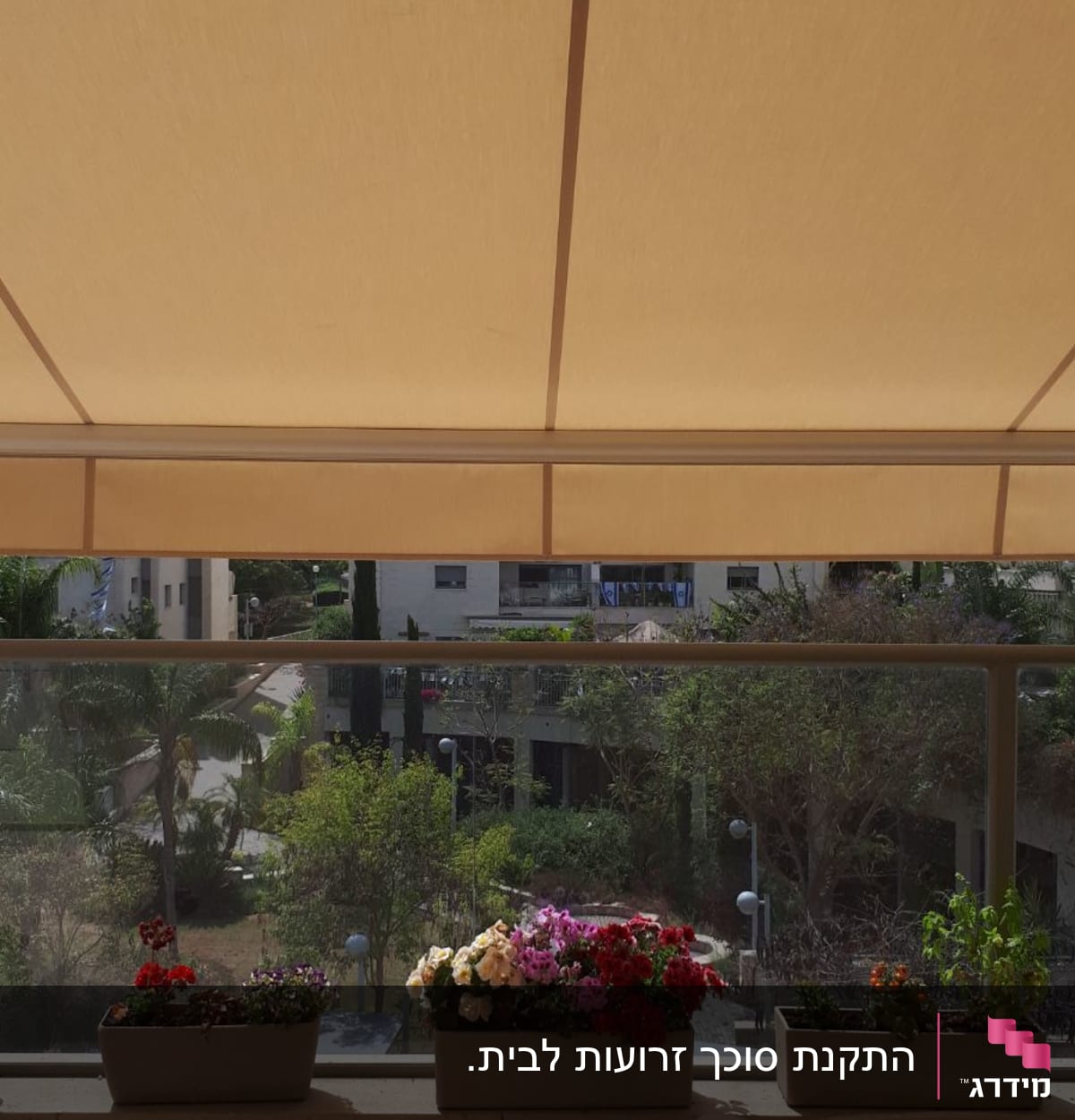 awning covering balcony with flower pots